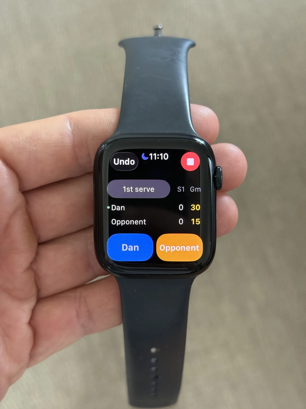MyTennisGame live scoring on Apple Watch, showing Dan and an opponent with buttons to record the point winner